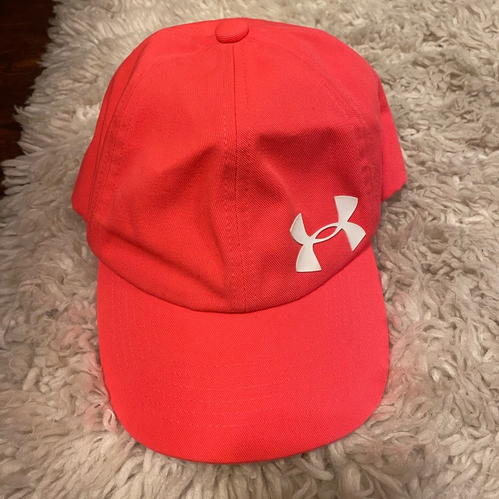 Pink youth size under armour hat, white logo.